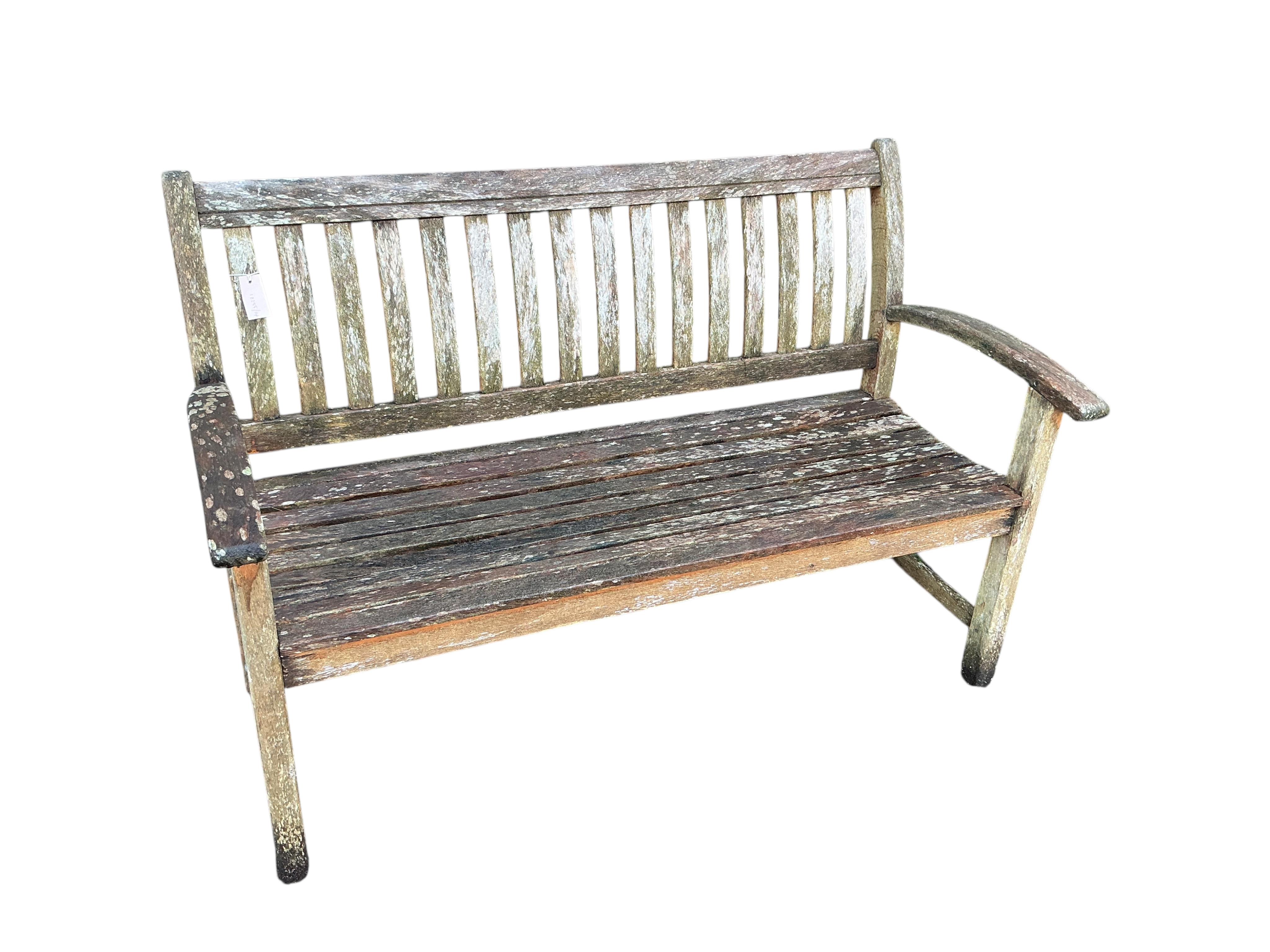 A weathered teak garden bench, width 139cm, depth 60cm, height 92cm
